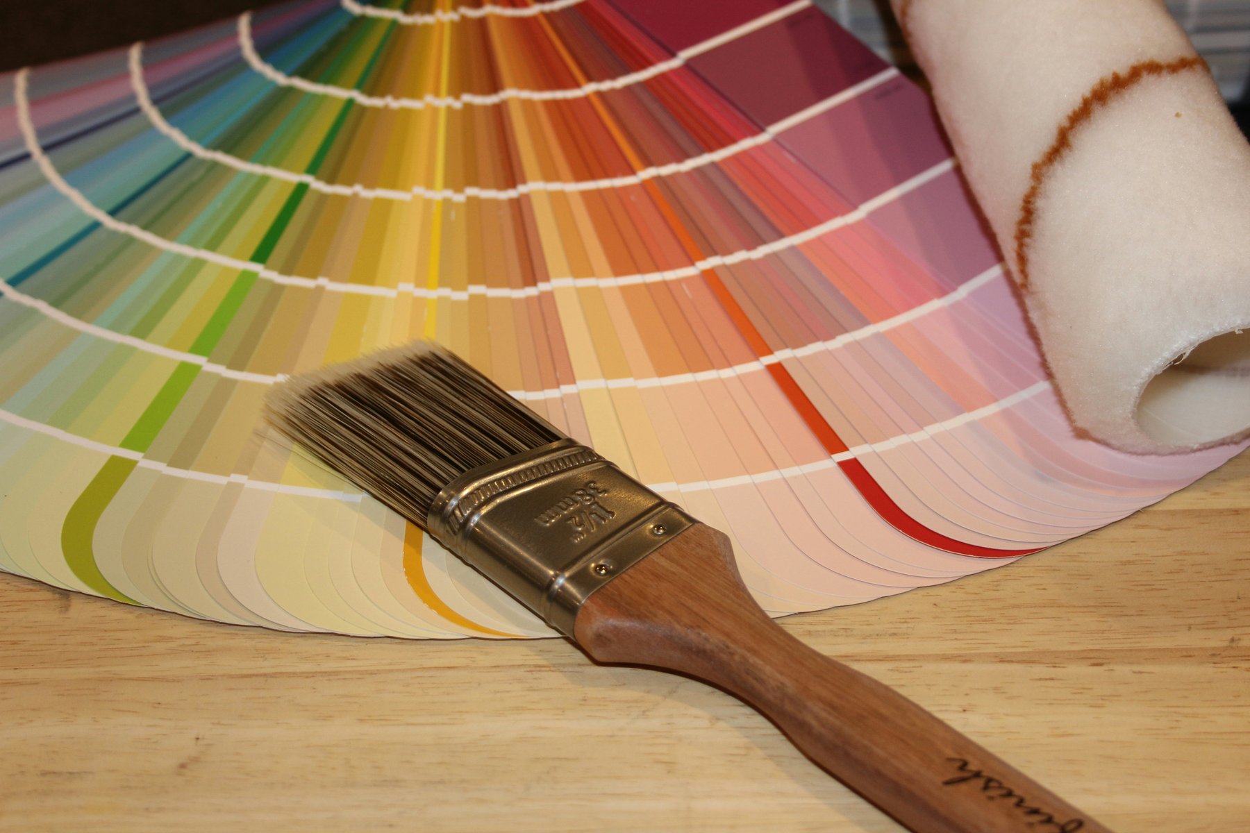 Paint color fan deck and brush for choosing a cabinet color
